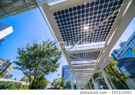 Kawasaki cityscape in Japan Summer. Severe heat, view of Kawasaki Station and solar panels at taxi stand = July 26 Kawasaki cityscape in Japan Summer. Severe heat, view of Kawasaki Station and solar panels at taxi stand = July 26 105321601