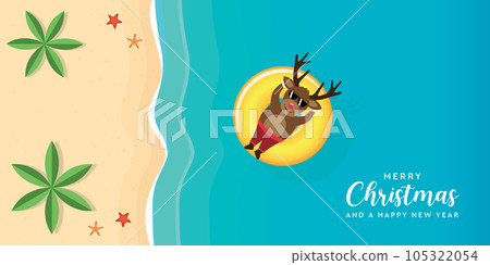 cute christmas deer relaxing on float ring in water on the beach 105322054