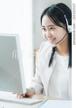 young woman doing online business young woman doing online business 105322517