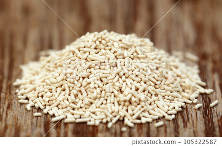 Yeast on a wooden spoon 105322587