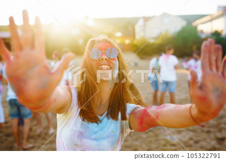 Group of people have fun at holi festival of colors. Party, vacation concept. Friendship concept. Group of people have fun at holi festival of colors. Party, vacation concept. Friendship concept. 105322791