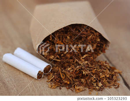 Dried tobacco leaves with cigarette 105323293