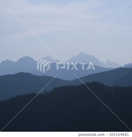 Mountain peaks in the morning light seen from Vorder Walig, Switzerland. Mountain peaks in the morning light seen from Vorder Walig, Switzerland. 105324681