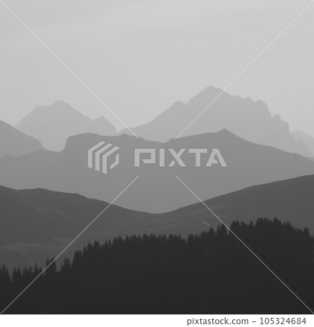 Dream like mountain ranges in the morning light seen from Vorder Walig, Switzerland. 105324684