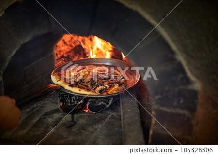 Pizza in a bread wood fired oven Pizza in a bread wood fired oven 105326306