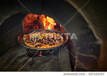 Pizza in a bread wood fired oven Pizza in a bread wood fired oven 105326307