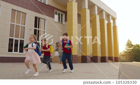 children enjoying childhood by running laughing together. attending school learning important lessons teamwork. carry backpacks have fun group, creating memories schoolyard. running children with children enjoying childhood by running laughing together. attending school learning important lessons teamwork. carry backpacks have fun group, creating memories schoolyard. running children with 105326330