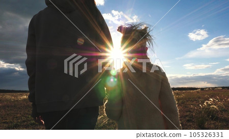 child mother father hand sunset sky, hand mom dad kid girl, happy family childhood dream, happy girl park parent, hold daughter hand, family silhouette, mother father day, walking grass sunset, walk child mother father hand sunset sky, hand mom dad kid girl, happy family childhood dream, happy girl park parent, hold daughter hand, family silhouette, mother father day, walking grass sunset, walk 105326331
