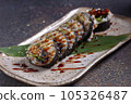 Sushi, delicious Japanese cuisine. Rolls of delicious sushi on a plate 105326487