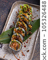 Sushi, delicious Japanese cuisine. Rolls of delicious sushi on a plate 105326488