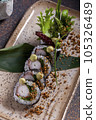 Sushi, delicious Japanese cuisine. Rolls of delicious sushi on a plate 105326489