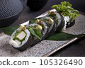Sushi, delicious Japanese cuisine. Rolls of delicious sushi on a plate 105326490