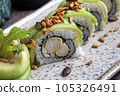 Sushi, delicious Japanese cuisine. Rolls of delicious sushi on a plate 105326491