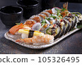 Sushi, delicious Japanese cuisine. Rolls of delicious sushi on a plate 105326495
