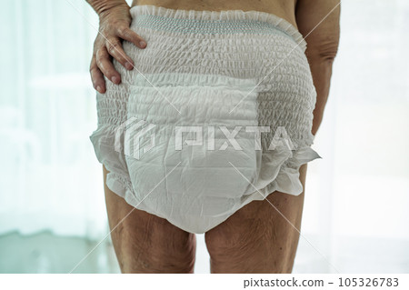 Asian senior woman patient wearing incontinence diaper in hospital, healthy strong medical concept. 105326783