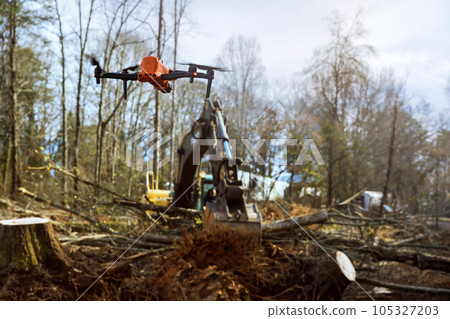 Monitoring uprooting trees at construction sites is being carried out by environmental services through use of drones. Monitoring uprooting trees at construction sites is being carried out by environmental services through use of drones. 105327203