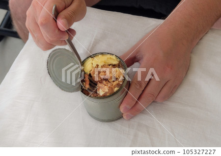 Stew in a tin can. Tourist food for outdoor activities. Camping food making. Stew in a tin can. Tourist food for outdoor activities. Camping food making. 105327227