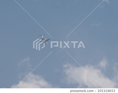 A passenger plane with a T-tail and rear engine flying over Kawaguchi City, Saitama Prefecture A passenger plane with a T-tail and rear engine flying over Kawaguchi City, Saitama Prefecture 105328653