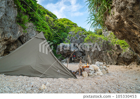 camping one person camping solo camping tent construction outdoors adventure rugged blue sky rocky area camping one person camping solo camping tent construction outdoors adventure rugged blue sky rocky area 105330453