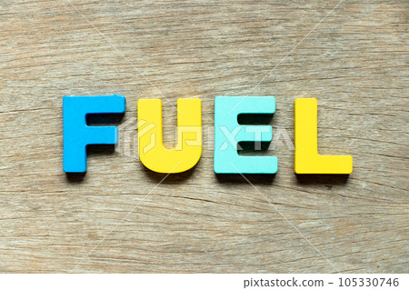 Color alphabet letter in word fuel on wood background 105330746