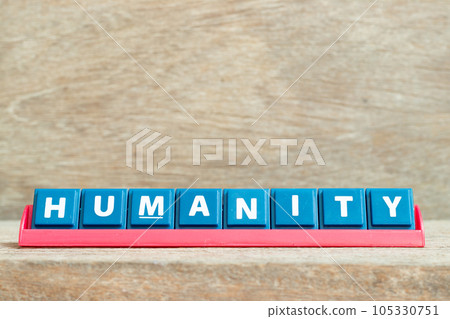Tile alphabet letter with word humanity in red color rack on wood background 105330751