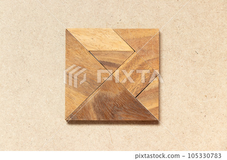 Wooden tangram in square or rectangle shape on wood background Wooden tangram in square or rectangle shape on wood background 105330783