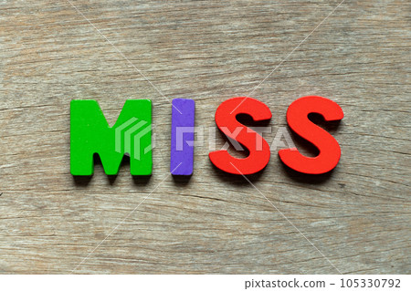 Color alphabet letter in word miss on wood background 105330792