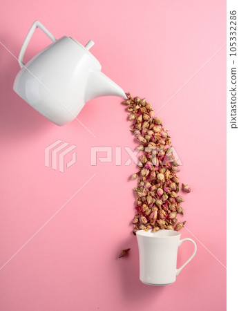 Dried rosebuds on a pink background. Dried rosebuds on a pink background. 105332286