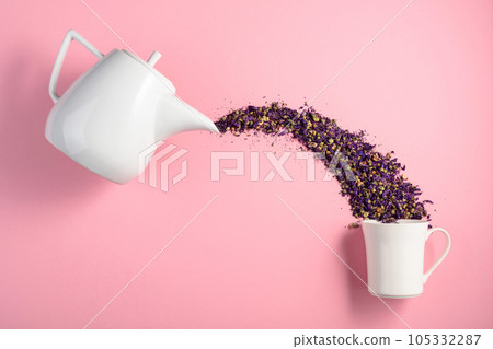 Dried lavender flowers on a pink background. Dried lavender flowers on a pink background. 105332287