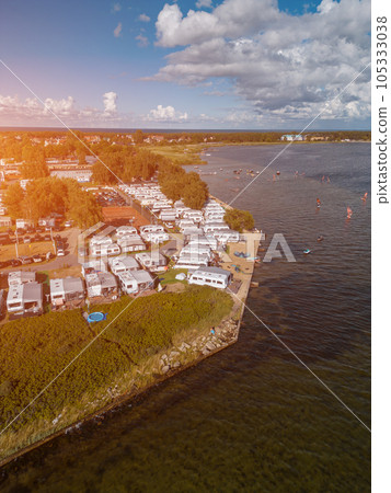 camping with trailers and campers at sea shore with beach, campsite aerial view camping with trailers and campers at sea shore with beach, campsite aerial view 105333038
