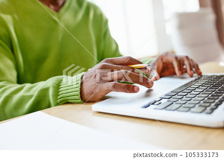 Close-up image of male hands typing on laptop. Using gadgets for online learning, distance work. 105333173