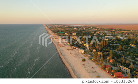 Panorama of sea shore in South Ukraine, Europe. Resort city with nice sand beach and clear blue sea. travel destination, ideal place for comfort vacation on black Sea. Drone photo 105333264