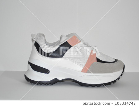 multi-colored female sneakers on a white background. Sport shoes multi-colored female sneakers on a white background. Sport shoes 105334742