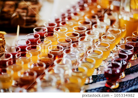 Selection of alcoholic drinks. Set of wine, brandy, hard liquor, liqueur, tincture, cognac, whiskey in glasses. Large variety of alcohol and spirits drink. Selection of alcoholic drinks. Set of wine, brandy, hard liquor, liqueur, tincture, cognac, whiskey in glasses. Large variety of alcohol and spirits drink. 105334982