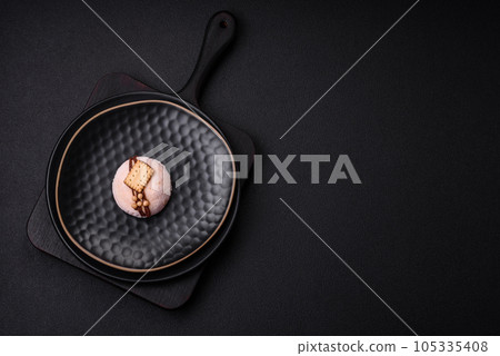 Delicious sweet colorful mochi desserts or ice cream with rice dough and toppings Delicious sweet colorful mochi desserts or ice cream with rice dough and toppings 105335408