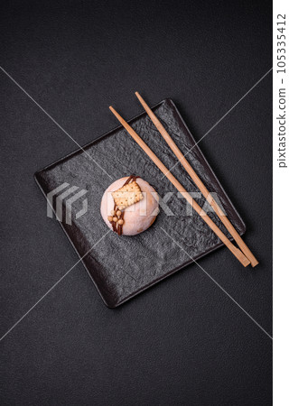 Delicious sweet colorful mochi desserts or ice cream with rice dough and toppings 105335412