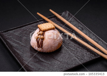 Delicious sweet colorful mochi desserts or ice cream with rice dough and toppings 105335413