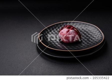 Delicious sweet colorful mochi desserts or ice cream with rice dough and toppings Delicious sweet colorful mochi desserts or ice cream with rice dough and toppings 105335422