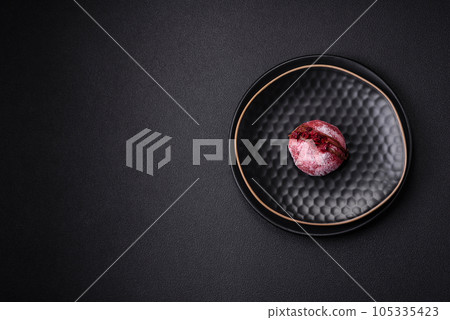 Delicious sweet colorful mochi desserts or ice cream with rice dough and toppings 105335423