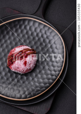 Delicious sweet colorful mochi desserts or ice cream with rice dough and toppings Delicious sweet colorful mochi desserts or ice cream with rice dough and toppings 105335430