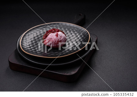 Delicious sweet colorful mochi desserts or ice cream with rice dough and toppings 105335432