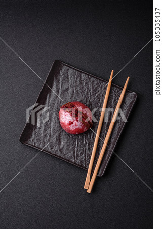 Delicious sweet colorful mochi desserts or ice cream with rice dough and toppings 105335437