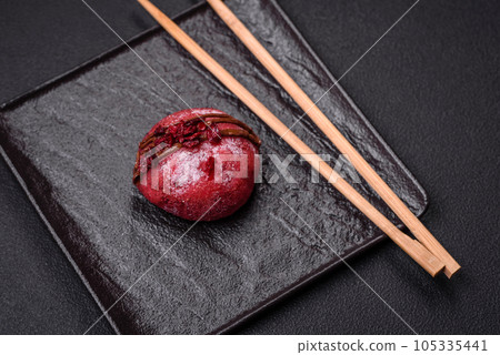 Delicious sweet colorful mochi desserts or ice cream with rice dough and toppings 105335441