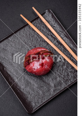 Delicious sweet colorful mochi desserts or ice cream with rice dough and toppings 105335442