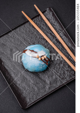 Delicious sweet colorful mochi desserts or ice cream with rice dough and toppings Delicious sweet colorful mochi desserts or ice cream with rice dough and toppings 105335464