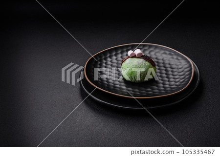 Delicious sweet colorful mochi desserts or ice cream with rice dough and toppings 105335467