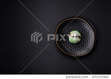 Delicious sweet colorful mochi desserts or ice cream with rice dough and toppings Delicious sweet colorful mochi desserts or ice cream with rice dough and toppings 105335468