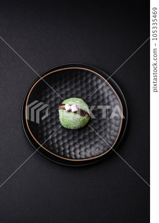 Delicious sweet colorful mochi desserts or ice cream with rice dough and toppings 105335469