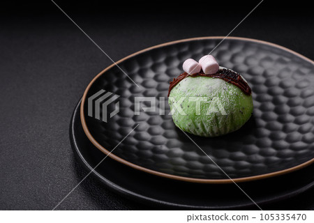 Delicious sweet colorful mochi desserts or ice cream with rice dough and toppings 105335470