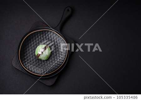 Delicious sweet colorful mochi desserts or ice cream with rice dough and toppings 105335486